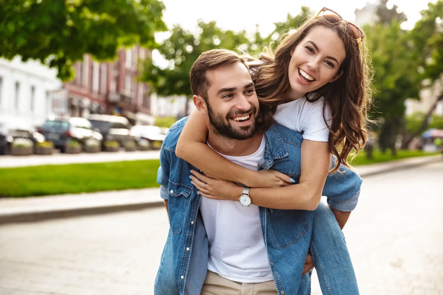 beautiful-young-couple-love-walking-outdoors-city-street-piggyback-ride